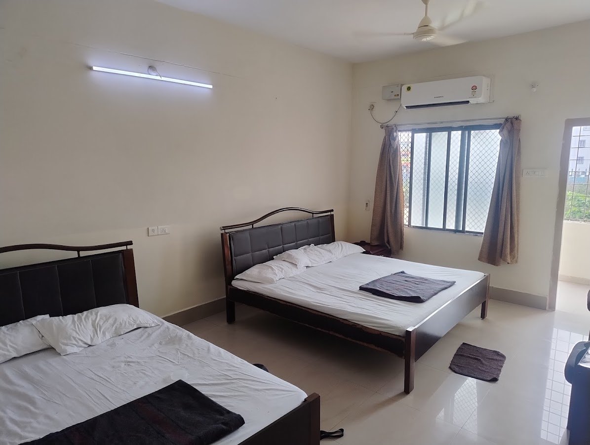 Visitor photograph showing beds and a window on the Madhavam listing